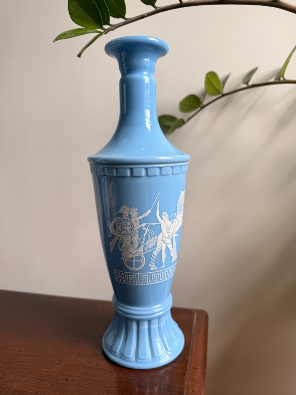 1960s Jim Beam blue milk glass decanter with a Greek chariot design.